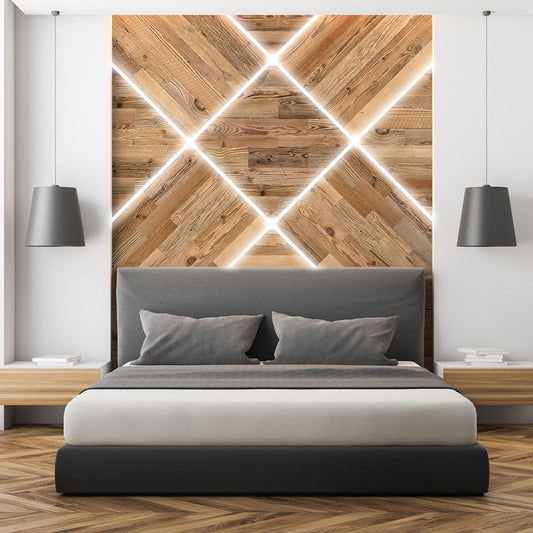 Chambre à coucher moderne présentant un lit gris, des tables de nuit en bois et des lampes suspendues. Derrière le lit, d'élégants panneaux Parement Bois Grange de Wood & Wall Decor™ avec rétroéclairage LED ajoutent un accent géométrique contemporain.