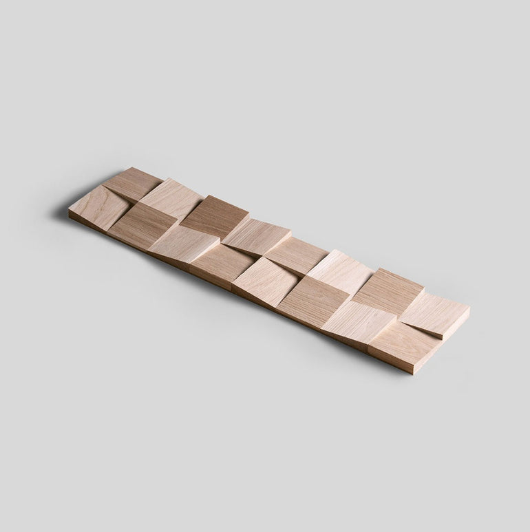 L'Échantillon Parement Bois de Wood & Wall Decor™ présente des carreaux carrés surélevés et inclinés dans des tons marron clair pour un effet géométrique 3D saisissant - parfait pour ajouter une touche moderne à votre espace. Choisissez votre design !.