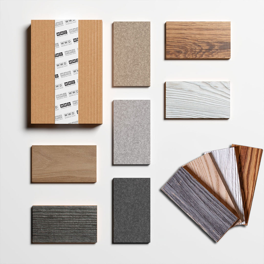 Une présentation à plat montre des échantillons d'Échantillon Parement Bois de Wood & Wall Decor™ - des échantillons de bois et de pierre, des emballages de marque et une variété de textures sur fond blanc - idéaux pour explorer les matériaux de votre prochain projet de design.