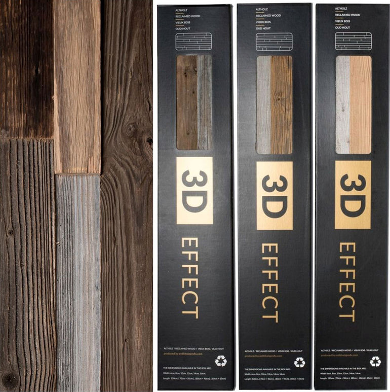 Trois boîtes étiquetées Parement Bois Antik by Wood & Wall Decor™ se tiennent debout à côté de panneaux de bois de différentes teintes brunes et grises, présentant différentes finitions et textures de bois.