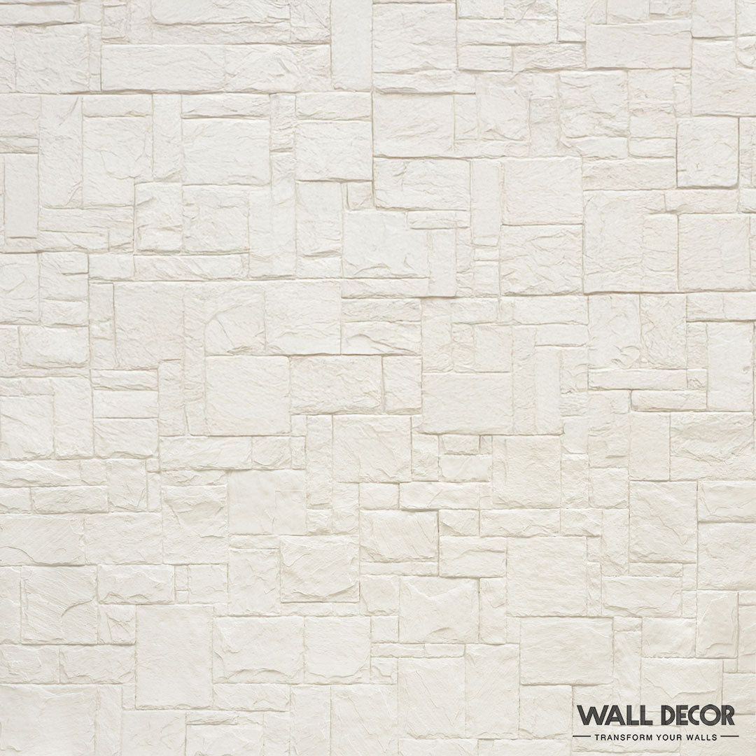 Un mur de briques blanches texturées dans un motif rectangulaire irrégulier, présentant Plaque Pierre Blanche - Style Travertin (2,85m x 1,3m : 3,7 m²) par Covering Panels™. Le logo et le slogan "Transform Your Walls" se trouvent dans le coin inférieur droit.