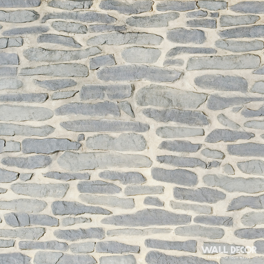 Un gros plan de Covering Panels™ Plaque Pierre grise - Pierres gneiss Ascona (2,85m x 1,3m, 3,7 m²) montre des pierres grises irrégulières avec un mortier clair dans un motif texturé et rustique ; un filigrane Wall Decor est visible dans le coin inférieur droit.