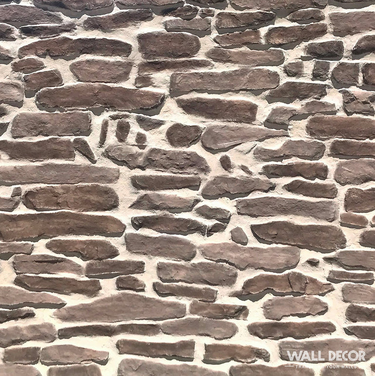 Gros plan sur la Plaque Pierre marron - Pierres gneiss Ascona (2,85m x 1,3m : 3,7 m²) de Covering Panels™, montrant ses pierres brunes irrégulières et son mortier clair, avec 